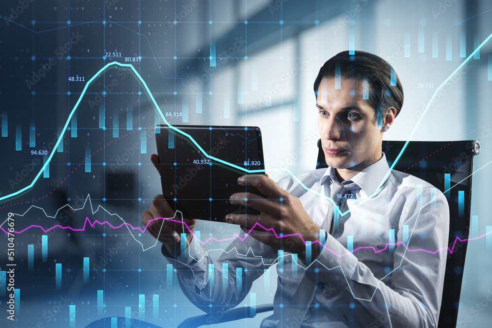 Aufkleber attractive european businessman using tablet while sitting in chair with abstract glowing forex grap