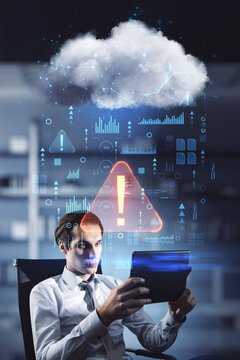 Attractive young european businessman with tablet sitting in blurry office interior with abstract hologram raining cloud. Data, information leak, security and theft concept. Double exposure.