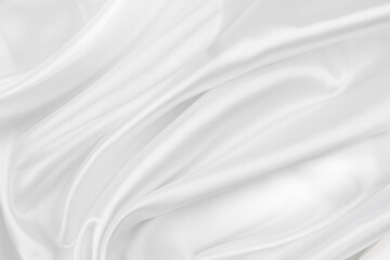 Close-up of rippled white silk fabric texture background
