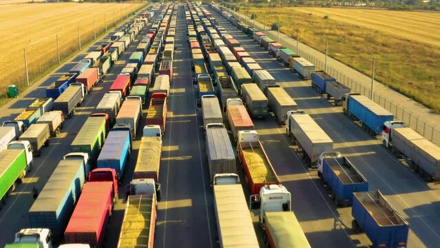 A huge queue of trucks loaded with grain crops in a blocked Ukrainian port. Humanitarian crisis due to the war.
