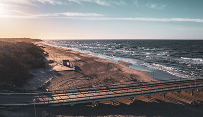 beach in winter with bridge sunset - Powered by Adobe