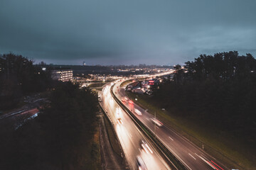 Multi-lane road in the European city Vilnius at night from aerial perspective in Lithuania