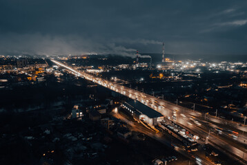Fototapeta na wymiar Multi-lane road in the European city Vilnius at night from aerial perspective in Lithuania