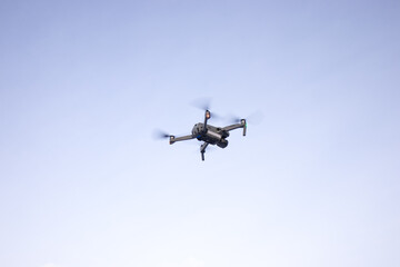 Small drone with good camera flying in the air for demonstration reference photo 