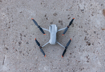 Small drone with good camera landed on the hard surface for demonstration reference photo