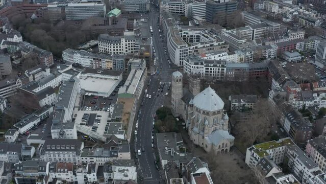 High angle view of historic St Gereon church and surrounding buildings in urban borough. Cologne, Germany