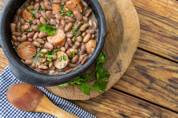 detail of feijoada with feijão manteiga (brazilian brown bean) with vegan pepperoni