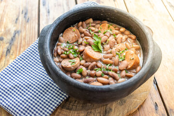 detail of feijoada with feijão manteiga (brazilian brown bean) with vegan pepperoni