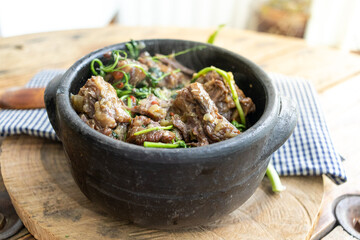 Oxtail with cress. Typical dish of Brazilian cuisine "Rabada".