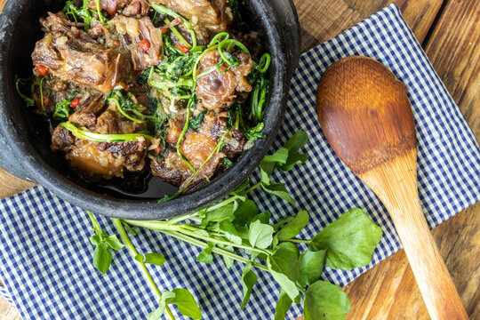 Oxtail with cress. Typical dish of Brazilian cuisine "Rabada".
