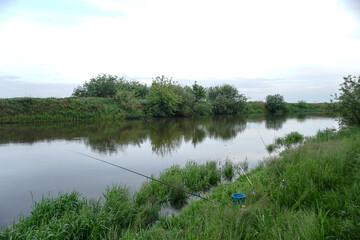 Evening landscape with the last rays of the sun. Morning by the river in summer. Beautiful nature, photo for design
