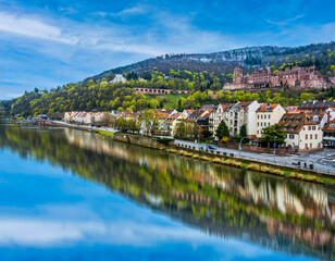 Fototapeta na wymiar Heidelberg river side town and palace during a summer day in Germany
