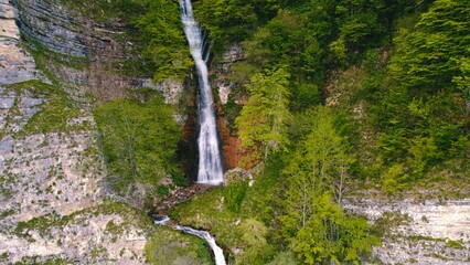 Panorama of an enormous Kinchkha waterfall on Okatse Canyon, near Kutaisi, Georgia, aerial shot....