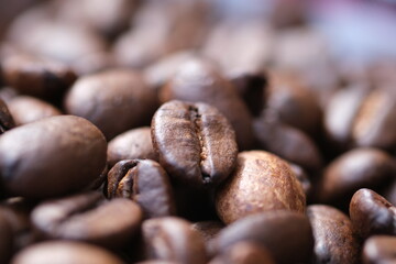 Coffee roasted beans closeup, coffee macro close up, selective focus. Defocused natural blurred background.