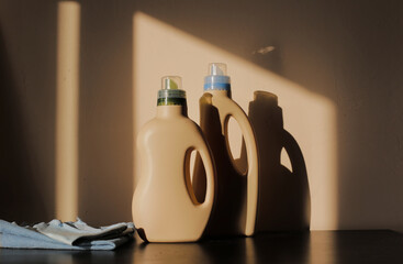 Eco-friendly detergent bottle and clean towel. Eco laundry concept