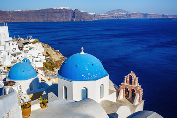 Oia church with cupola painted blue, Santorini island in Greece. - obrazy, fototapety, plakaty