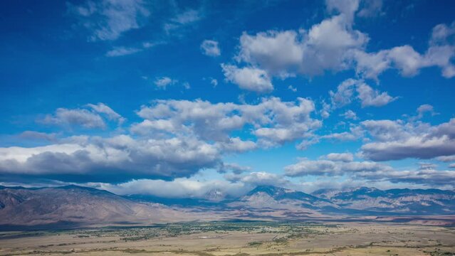Time Lapse - Beautiful cloudscape moving over mountain range and the valley