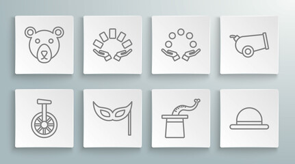 Set line Unicycle or one wheel bicycle, Hand holding playing cards, Festive mask, Magician hat, Clown, Juggling ball, Cannon and Bear head icon. Vector © Oksana