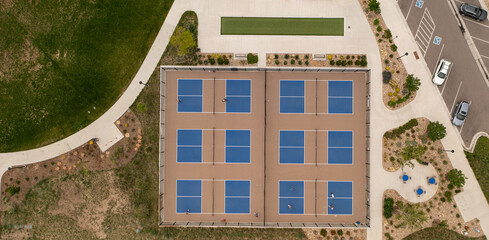 Overhead image of multiple pickleball sports courts community amenities