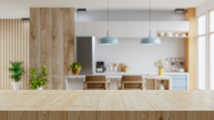 Wooden table top on blur kitchen room background,Modern Contemporary kitchen room interior. - obrazy, fototapety, plakaty