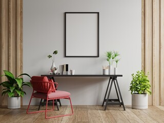 Poster mockup with vertical frames on empty white wall in living room interior with red armchair.