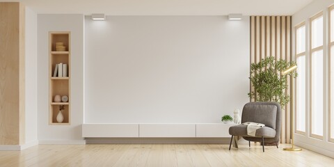 Mockup a TV wall mounted with armchair in living room with a white wall.