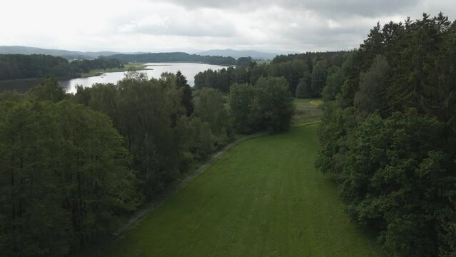 Aerial view over the lake and trees of Bavaria forest