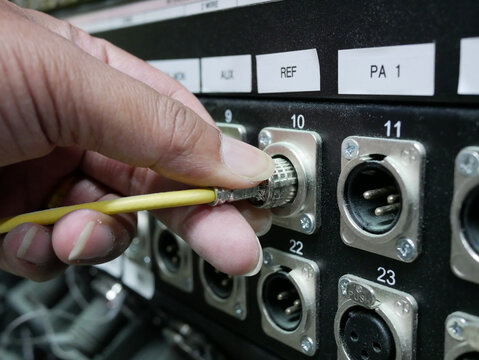 Technicians adjustment BNC SDI signal cables plugged on path panel.