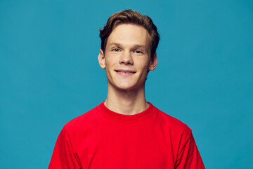 portrait of a joyful guy in a red shirt