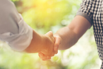 Trust honesty business customer handshake together promise respect partner. Businessman diversity...