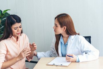 Woman doctor holding hands patient encourage cheer up consultation at hospital medicare treatment clinic. Doctor talking to patient support giving hope listening takecare for mental health therapy