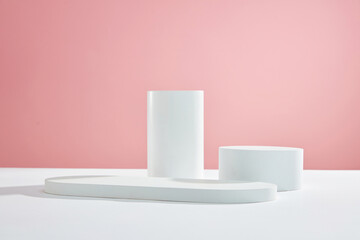 Front view of white podium and stairway with blank space in pink background abstract content
