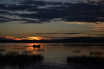 Obraz premium sunset over Tupper Lake with row boat