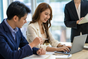 Asian Business people meeting time working with new startup project. Idea presentation, analyze plans. Business Discussing some business ideas. Teamwork concept.