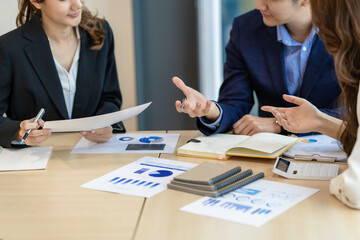 Asian Business people meeting time working with new startup project. Idea presentation, analyze plans. Business Discussing some business ideas. Teamwork concept.