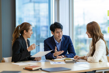 Asian Business people meeting time working with new startup project. Idea presentation, analyze plans. Business Discussing some business ideas. Teamwork concept.