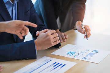 A male business consultant describes a marketing plan to set business strategies for women business...