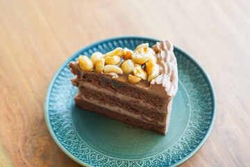 A slice of layered honey chocolate cake