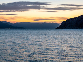 Sunset over Saronic gulf sea, Perdika village, Aegina, Greece. Magic light, tranquil, relaxing...