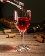 stylized wine glass on wooden base