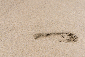 Footprints on the beach sand