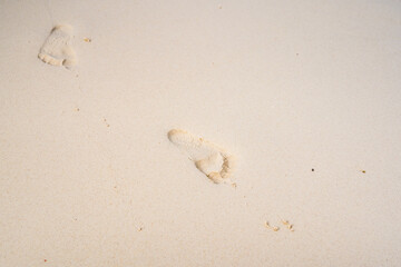 Footprints on the beach sand