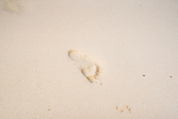 Footprints on the beach sand