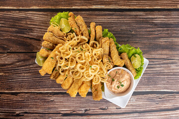 Appetizer - portion of fish with onion rings