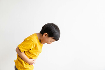 Ulcerative colitis or Hepatitis b liver virus concept.Kid asian child boy stomach pain on white...