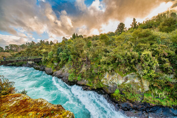 Naklejka na ściany i meble Amazing sunset colors of powerful Huka Falls, New Zealand