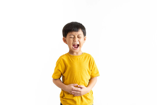 Ulcerative colitis or Hepatitis b liver virus concept.Kid asian child boy stomach pain on white background.food poisoning.childhood pain on his tummy.bellyache.medicine medical health.hepatitis virus.