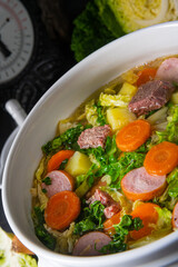 delicious savoy cabbage soup in white vase