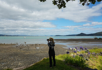 A Woman walking and taking pictures around Whangarei City, Northland, New Zealand.