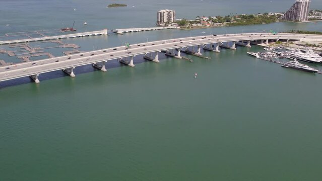 Aerial Forward Shot Of Cars Moving On Bridge Roads Over Sea - Miami, Florida